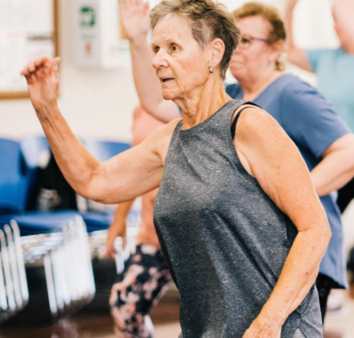 Elderly Woman in an Exercise Class